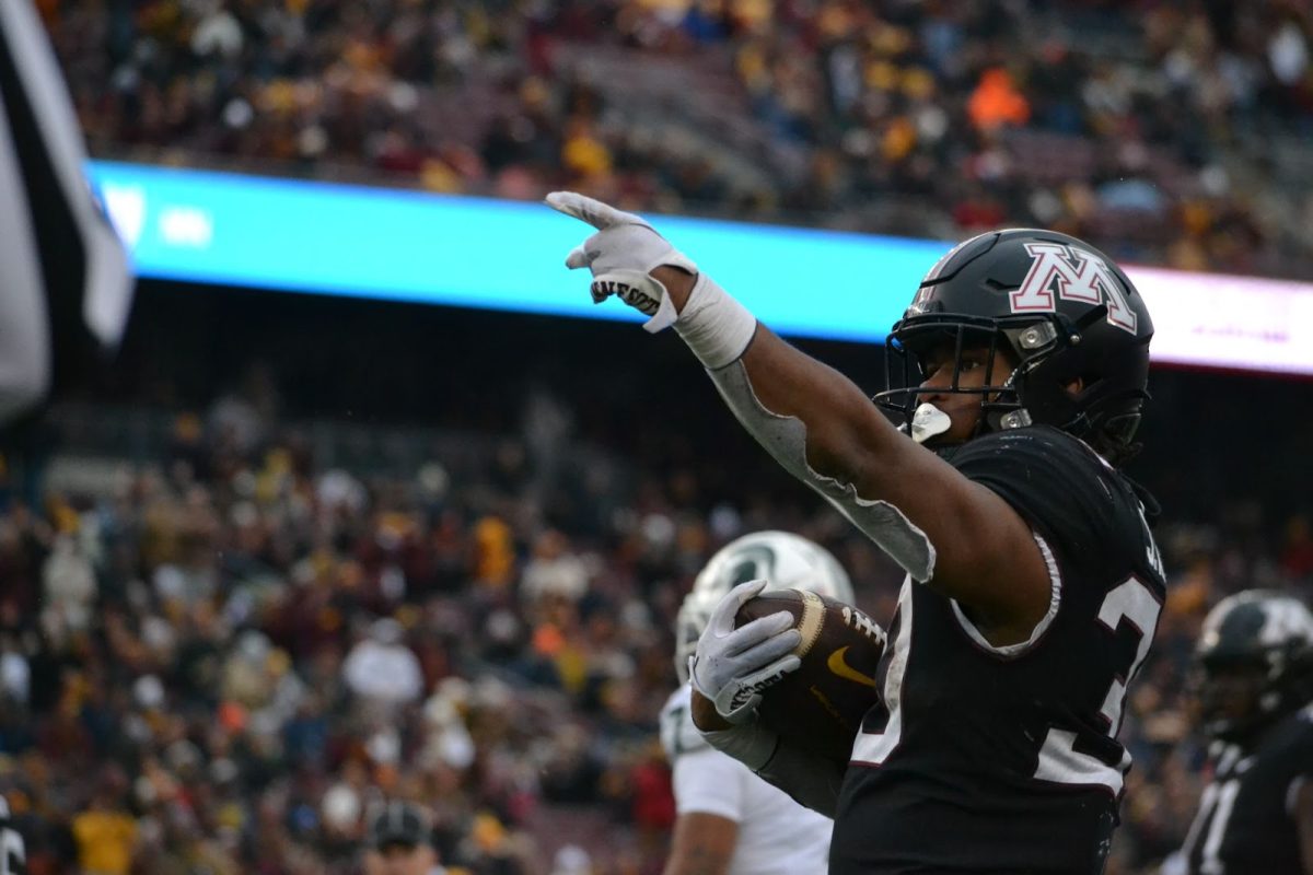 Tailback Jordan Nubin points to the Huntington Bank crowd after a successful play against Michigan State on Oct. 28, 2023.
