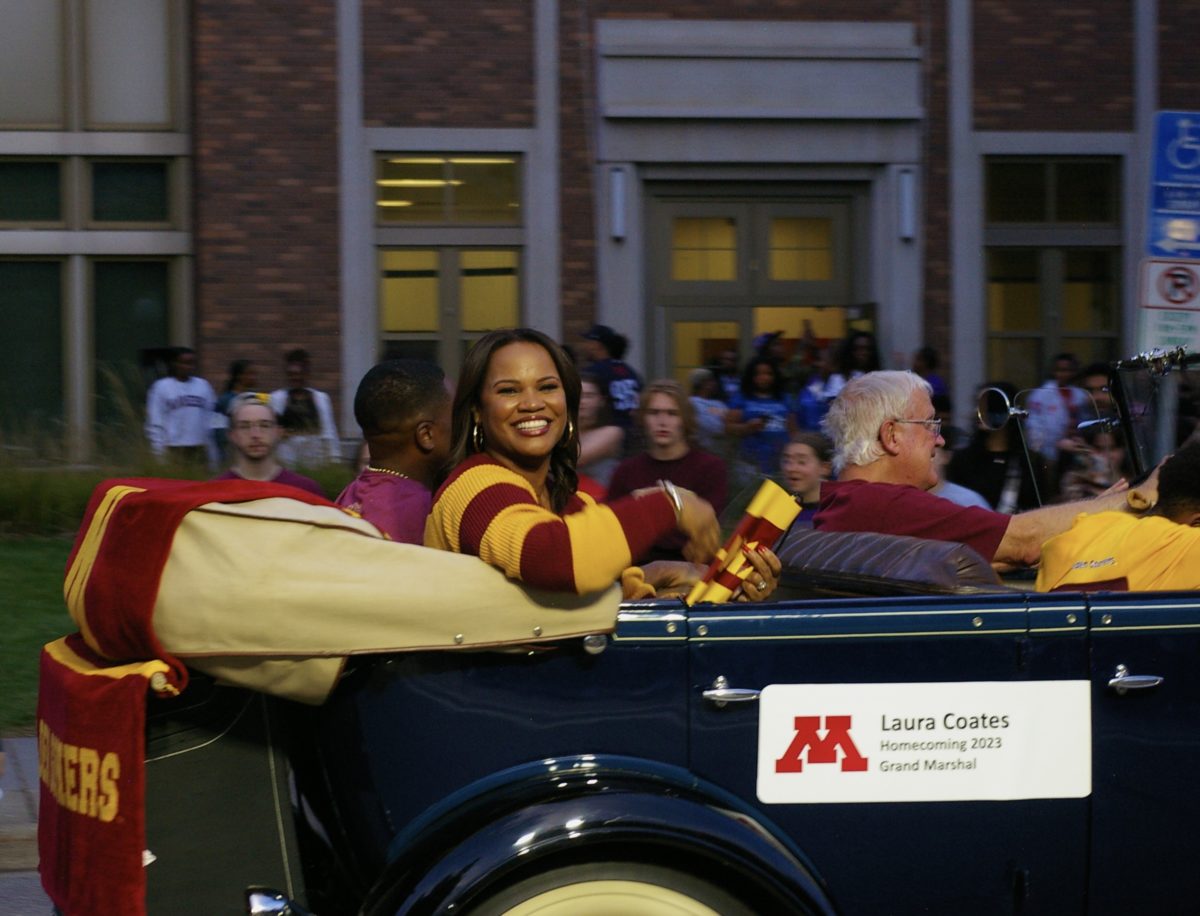 Laura Coates rides along in the Homecoming parade on Friday, Sept. 30.
