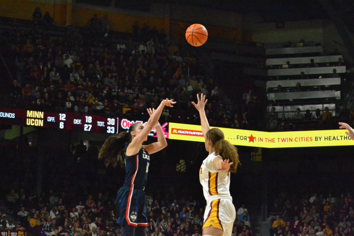 Amaya Battle tries to block a shot on Sunday, Nov. 19, 2023. The Gopher’s Women Basketball team faced off against University of Connecticut, and lost with a score of 62-44. 