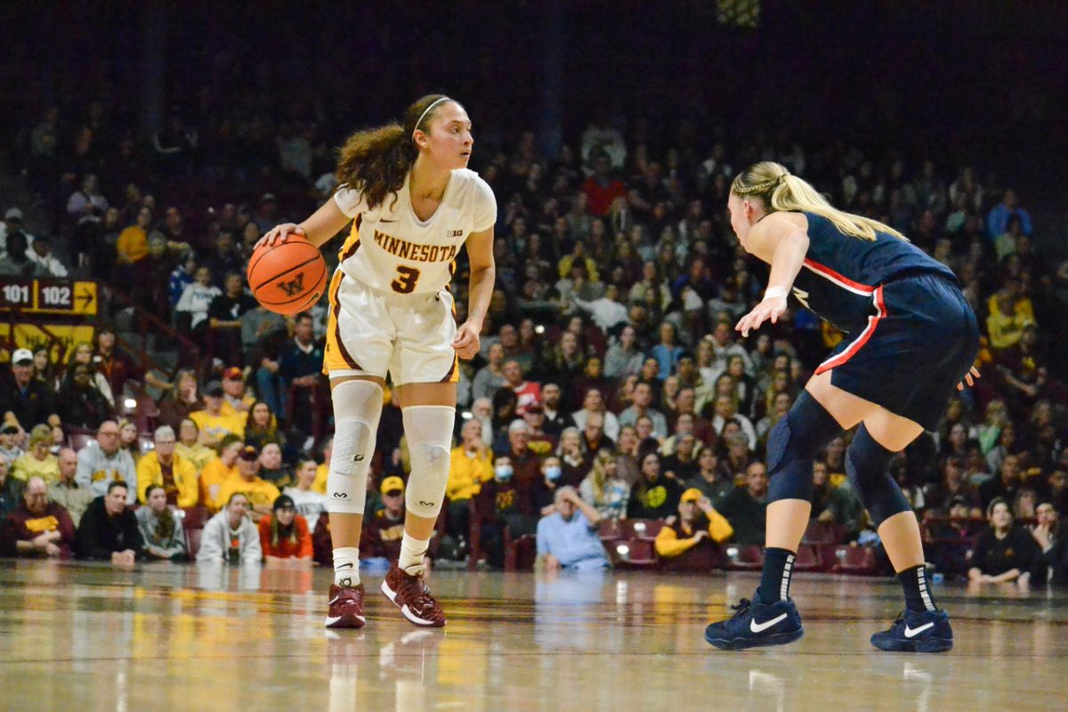 Amaya Battle dribbles the ball on Sunday, Nov. 19, 2023. The Gopher’s Women Basketball team faced off against University of Connecticut, and lost with a score of 62-44.