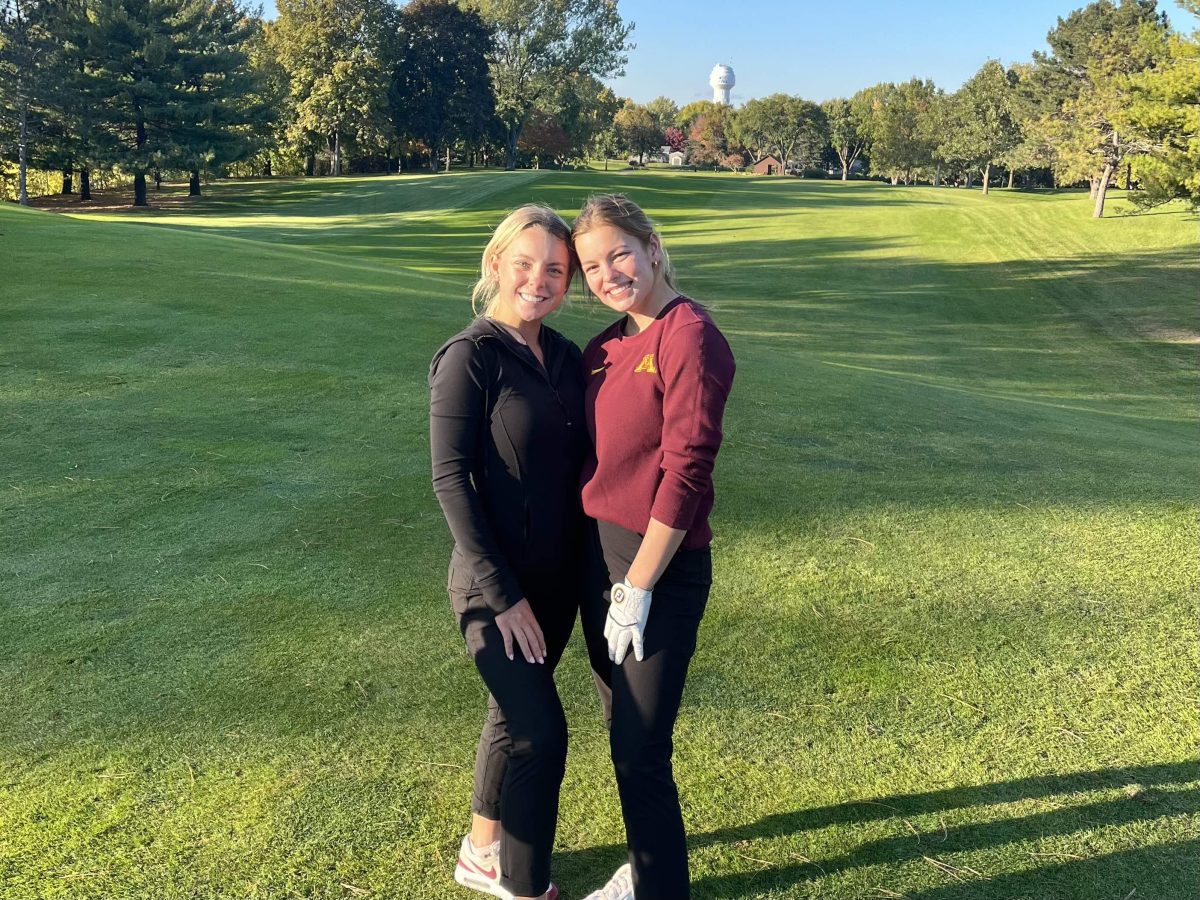 Bella (left) and Reese (right) McCauley posing together on the fairway.