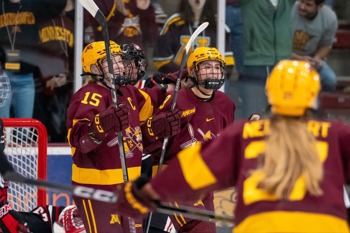 Peyton Hemp (No. 15), Ava Lindsay (No. 9) and Solveig Neunzert (No. 27) celebrate a goal versus St. Cloud State on Oct. 17. The Gophers won the game 2-1.