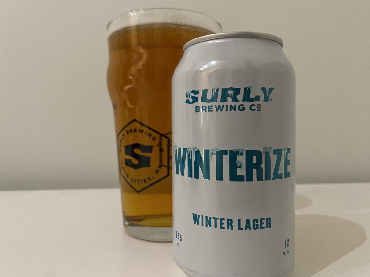 A can of Surly Winterize poured into a pint glass.