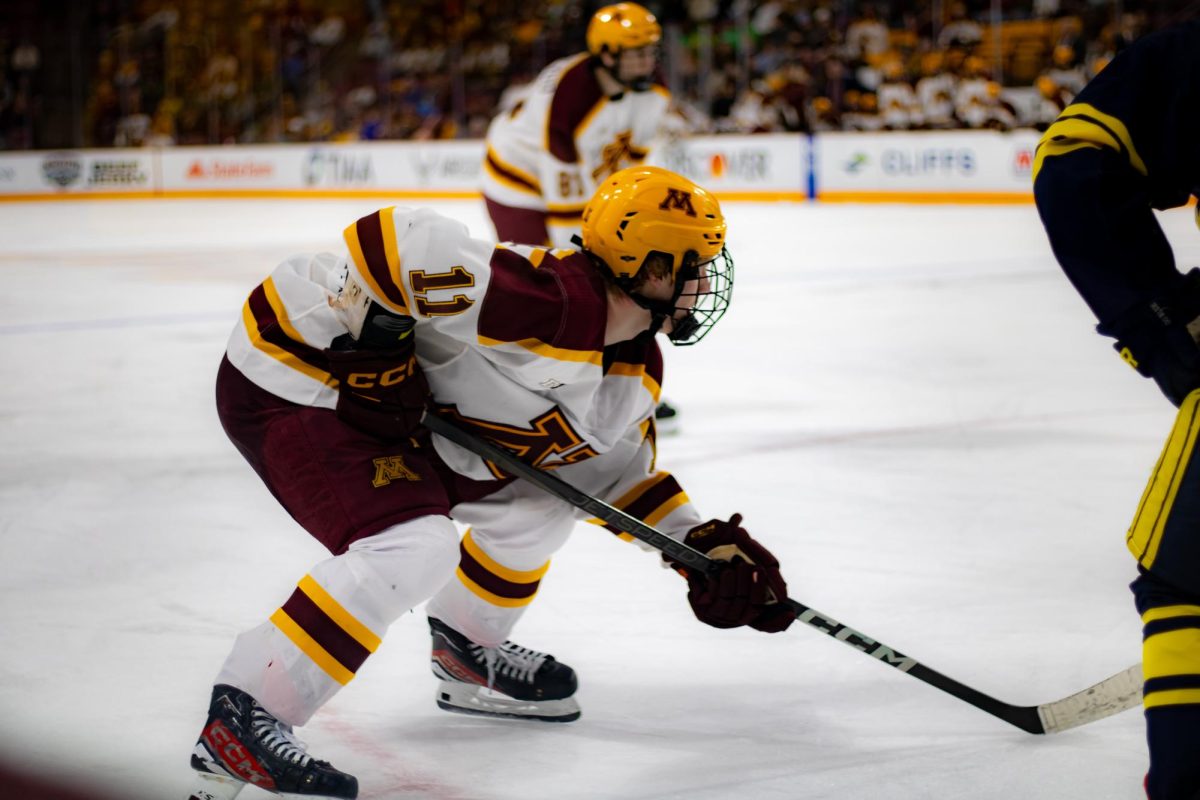 Forward Oliver Moore prepares for the puck drop at the game against Michigan on Saturday, March 16. The Gophers avoided a shutout after scoring with 1:29 remaining in the third period.
