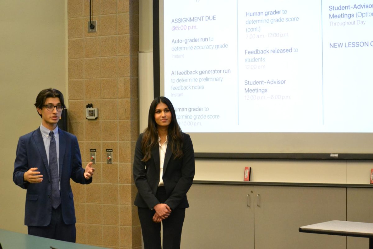 Amit Konda (left) and Aashna Gautam (right) present at the CoMIS Case Competition at the Carlson School of Management on Friday. The CoMIS competition, held at the Graduate, included a 24-hour case competition, networking and speaker events. 