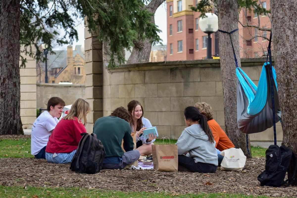 A group of students took advantage of the warm weather as they picnic at the Knoll on Wednesday.