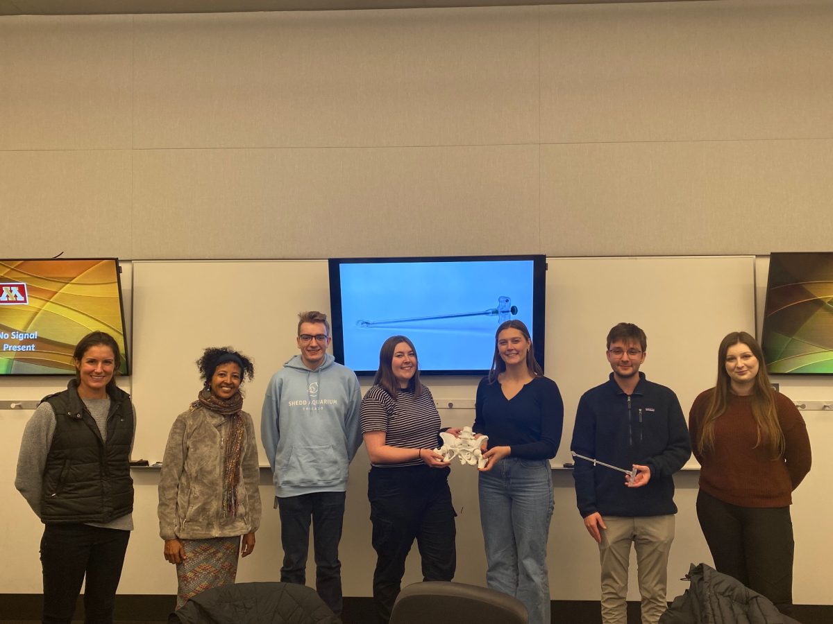 Rahel Nardos with Tinen Iles and the student engineering team holding presenting their new pelvic floor surgical device. Current pelvic floor tools used in low-income countries like Ethiopia are outdated and difficult to use, causing serious health risks. 