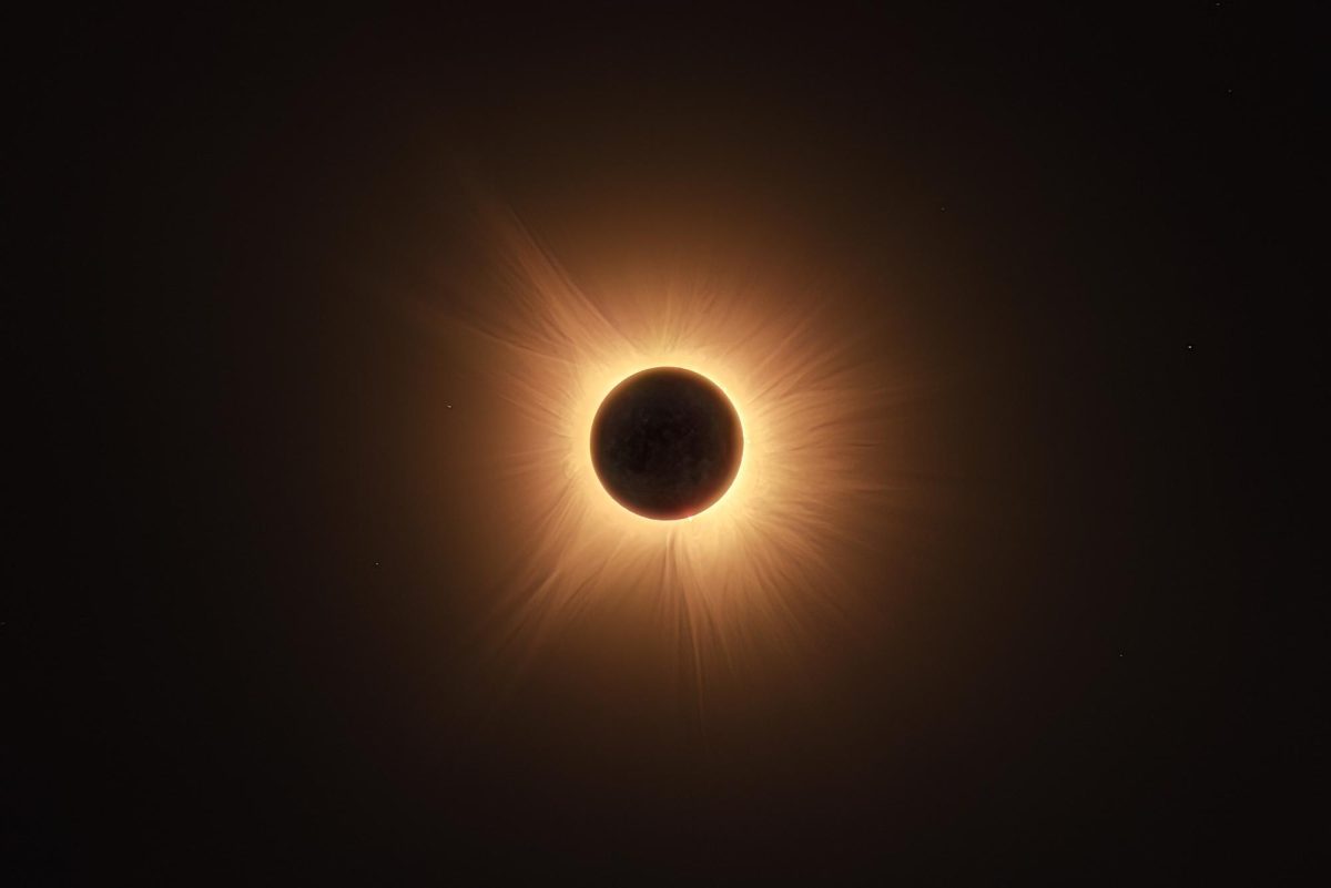 The moon passes in front of the sun during a solar eclipse, revealing solar prominences, faint stars and the glow of the sun’s corona. The corona, normally hidden by the bright light of the sun’s surface, can be seen with the naked eye during the darkness of a total solar eclipse. Bracketed and stacked exposure was captured during totality on Monday in southern Illinois. 