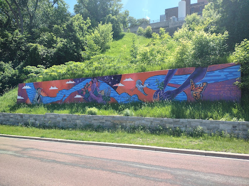 “What will sustain us?” by Xena Goldman on the West River Parkway, one of the artists behind the George Floyd memorial mural. Image by Sam Hill