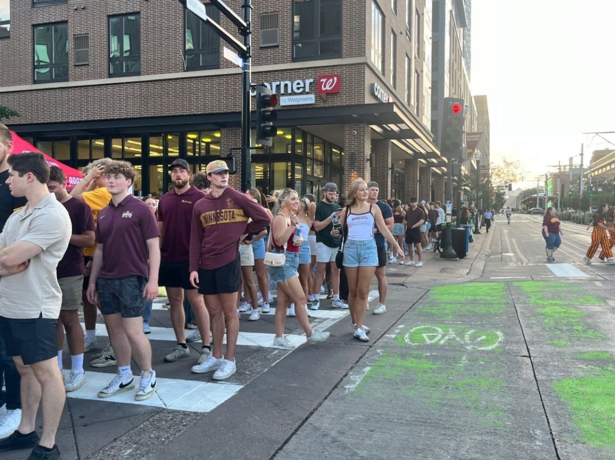 Gophers fans lined up outside Sally’s Saloon in Minneapolis on Saturday, Sept. 21.