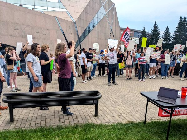 GLU picketed outside the McNamara Alumni Center on July 12. Image courtesy of Alex Provan.