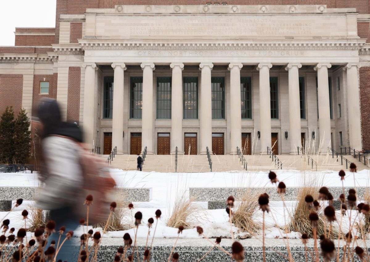 Students walk through the Mall, passing by Northrop Memorial Auditorium, Feb. 9, 2026.