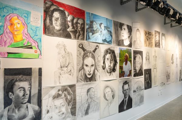 Students' drawings, including the work of BFA student Madelyn Churchill, is on display at the Regis Center for the Arts West on Apr. 19, 2026. Churchill's BFA exhibition is available for viewing across the street at the Katherine E. Nash Gallery.