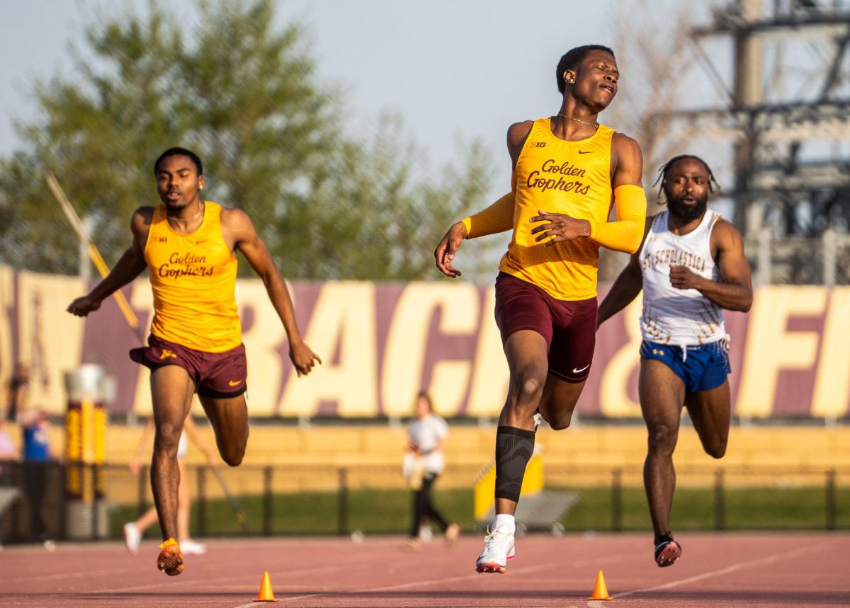 Jayden Green (center) breaks the meet record in the 200m, placing second it in a time of 20.65. His teammate a few lanes to the left Zion Campbell (not pictured) ran 20.49 to win the event, April 22, 2026.
