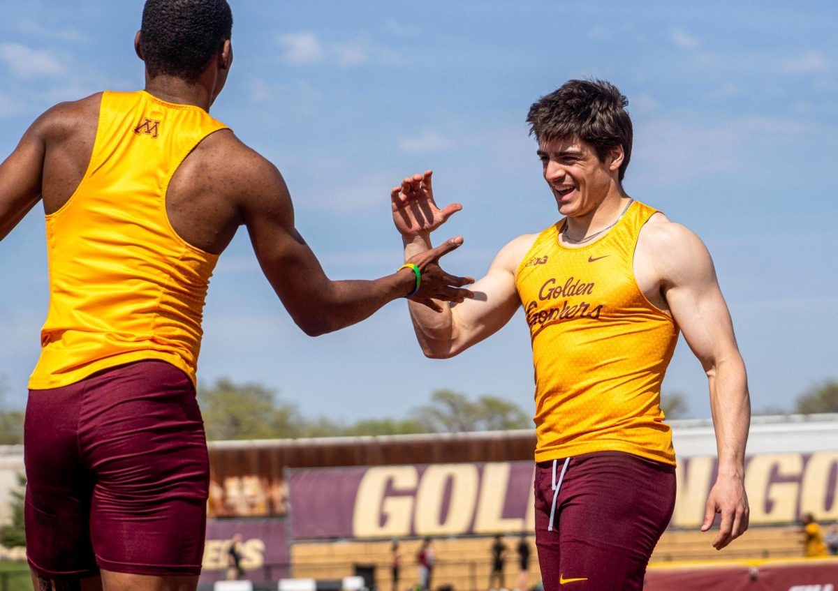 Zion Campbell and Joseph Manser celebrate after qualifying out of their prelim heat for the 100-meter final, April 22, 2026. 