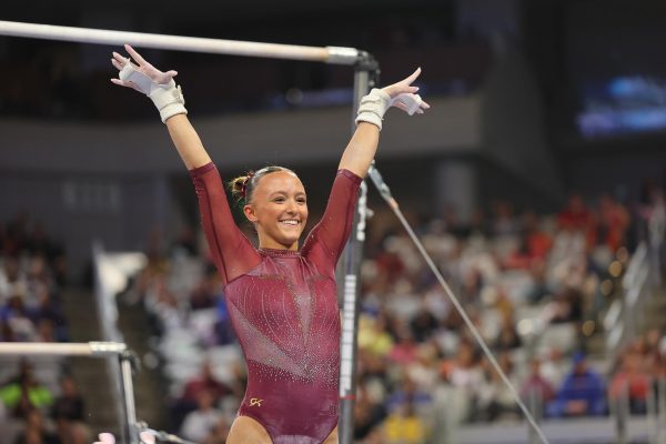 Freshman Arianna Ostrum finishing her routine on the uneven bars for the University of Minnesota. | Photo courtesy of the University of Minnesota.