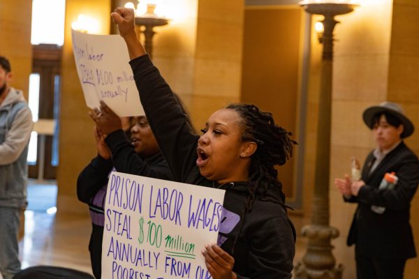 Marvina Haynes, executive director of MN Wrongfully Convicted Judicial Reform, stands with End Slavery in Minnesota for prison reform.