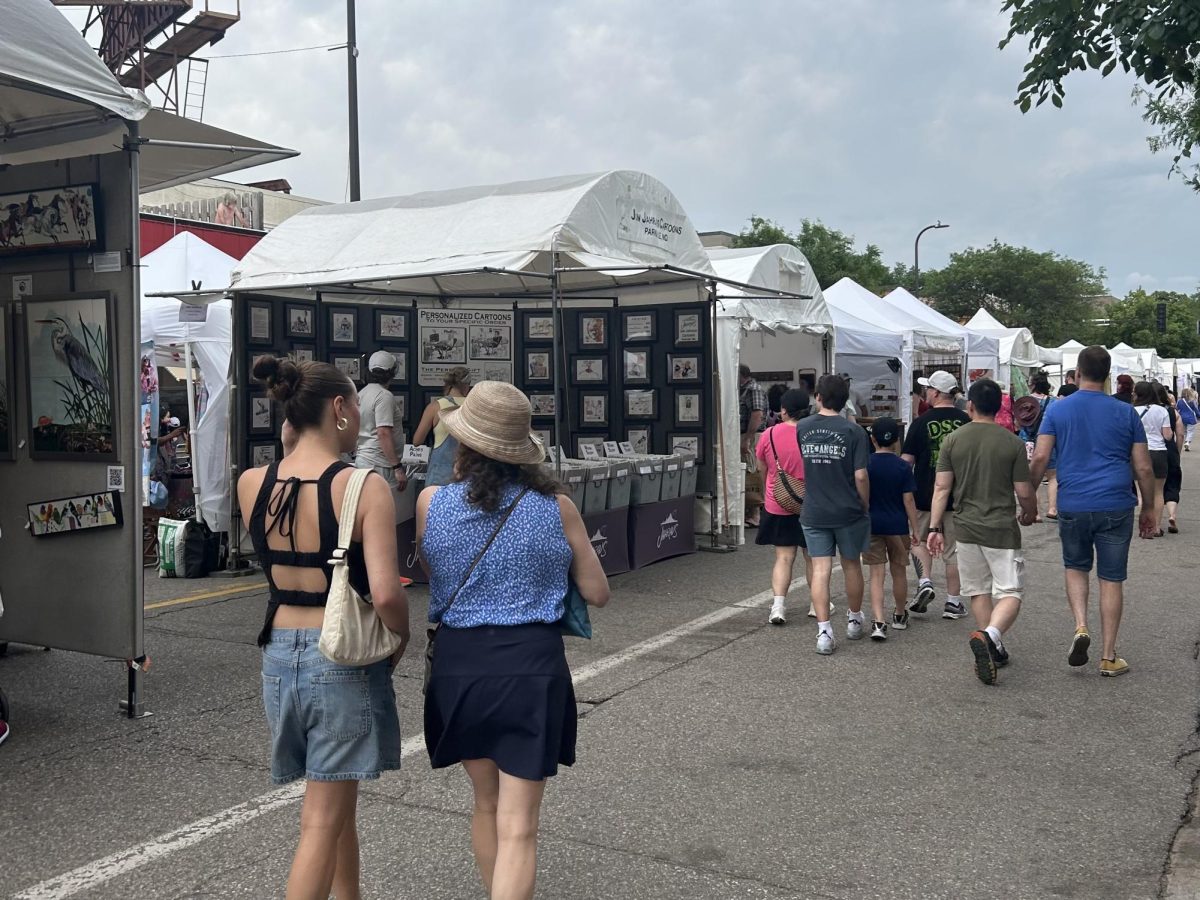 Visitors peruse different booths at the 59th Edina Art Fair on June 7, 2026.
