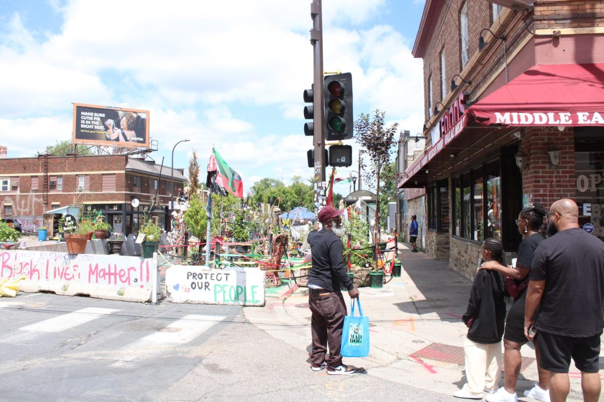 Marquise Bowie gives a tour of George Floyd Square to the Patterson family. Minneapolis, MN. June 25, 2026.
