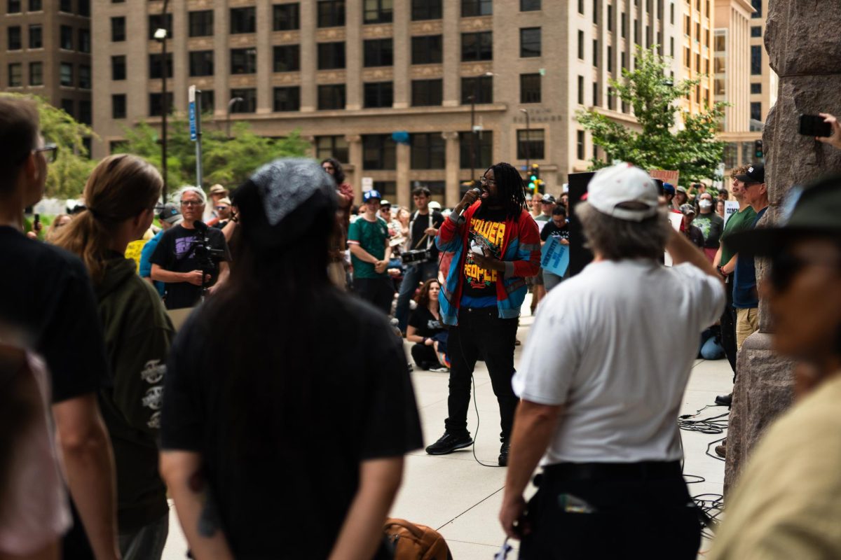 A protestor leads anti-ICE chants at a protest for the 15 defendents facing federal conspiracy charges related to protesting ICE during Operation Metro Surge at Diana E. Murphy United States Courthouse in Minneapolis, Minn. Wednesday, July 1, 2026.