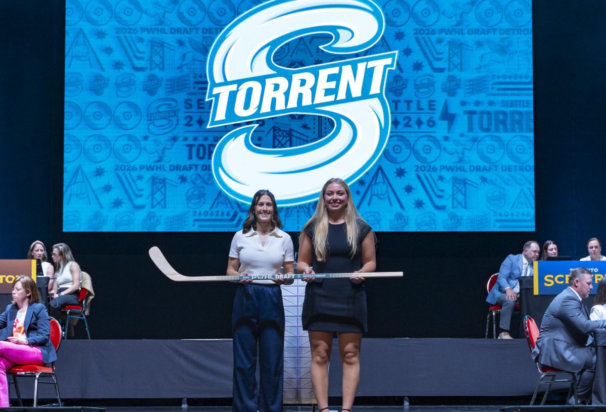 Sydney Morrow with Seattle Torrent General Manager Meghan Turner after being selected 14th overall during the PWHL draft. June 17, 2026. | Credit - Heather Pollock, PWHL