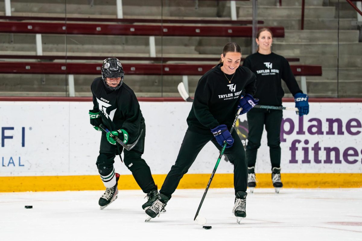 Taylor Heise works with a skater at her 2nd annual TH27 camp. | Photo courtesy of Ariana Golemis.